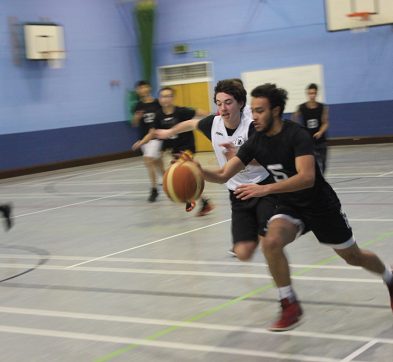 students playing basketball