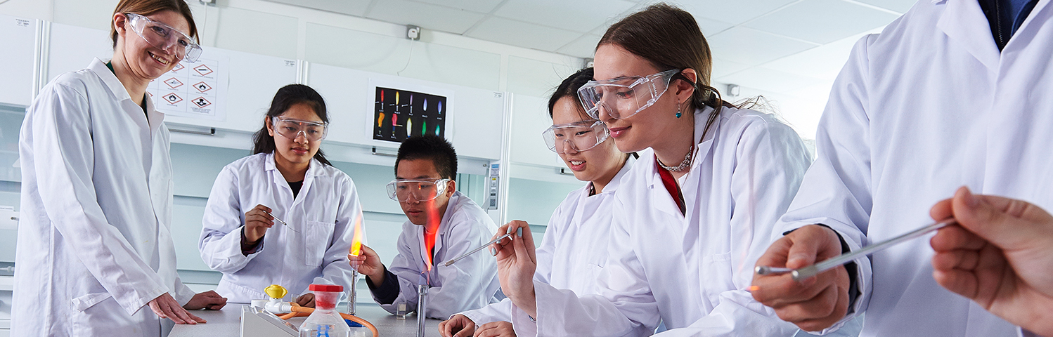 Abbey College Cambridge student and teacher in A Level chemistry practical class