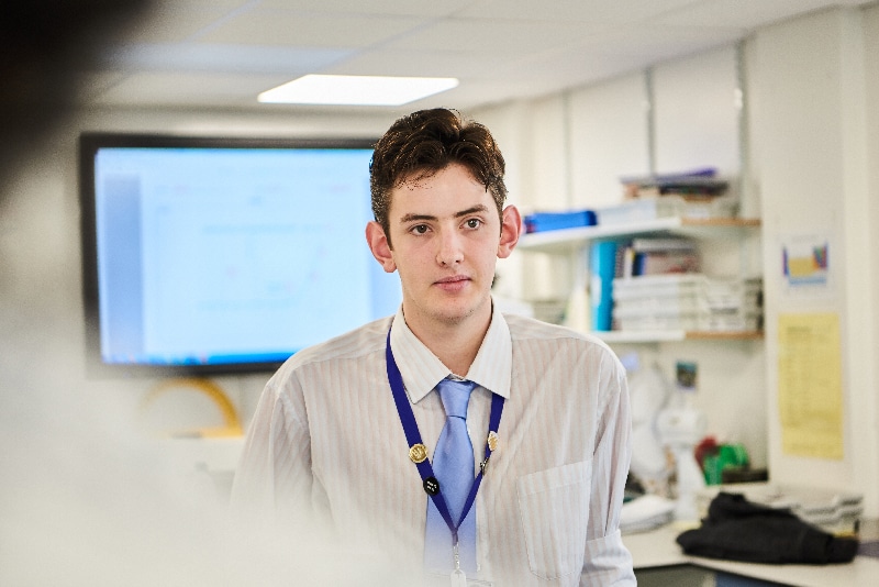 a student wearing a white shirt