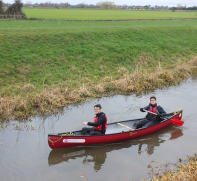 2 students sat in a canoe