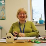 Teacher at the desk