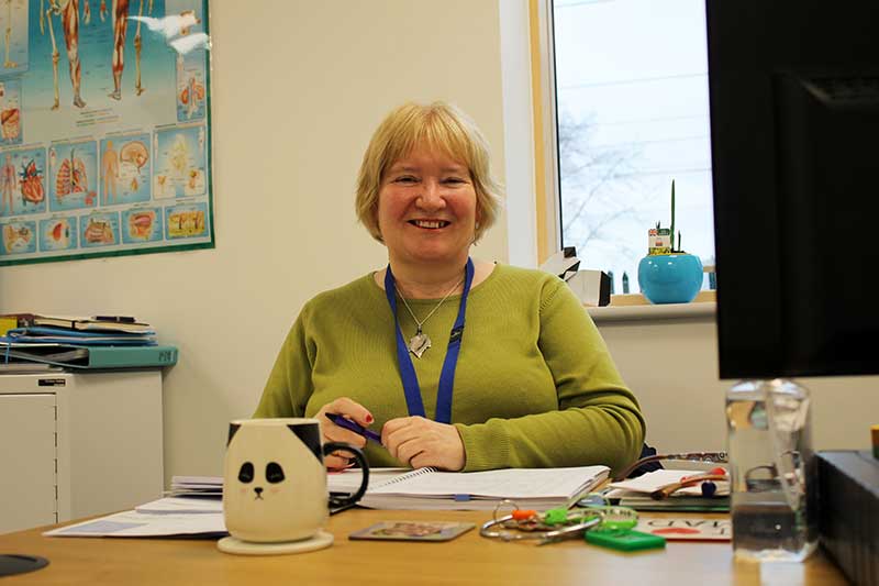 Teacher at the desk