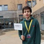 student holding a flag in his hand