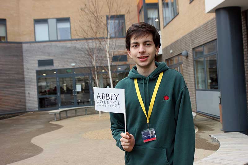 student holding a flag in his hand