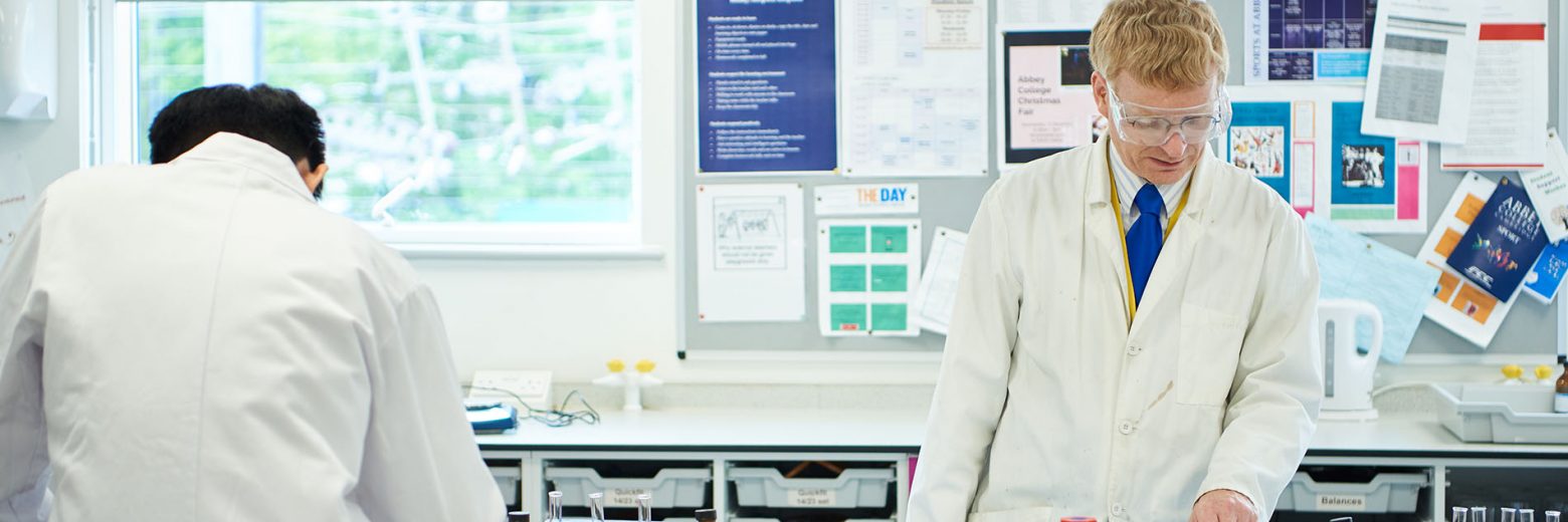 Teacher and student in Abbey College Cambridge Chemistry class