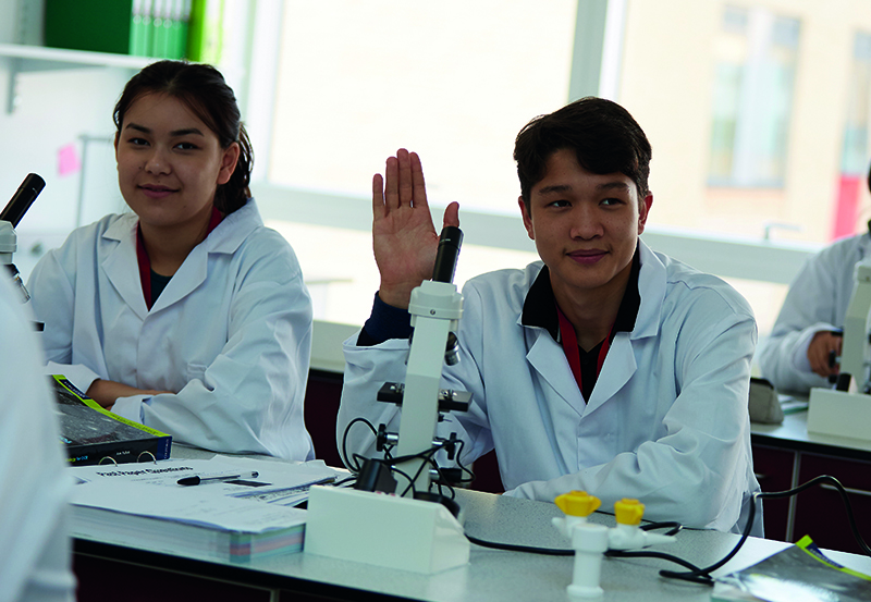 Biology students in class at Abbey College Cambridge