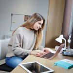 Student Studying In Her Bedroom At Abbey College Cambridge