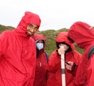 children in red rain coats