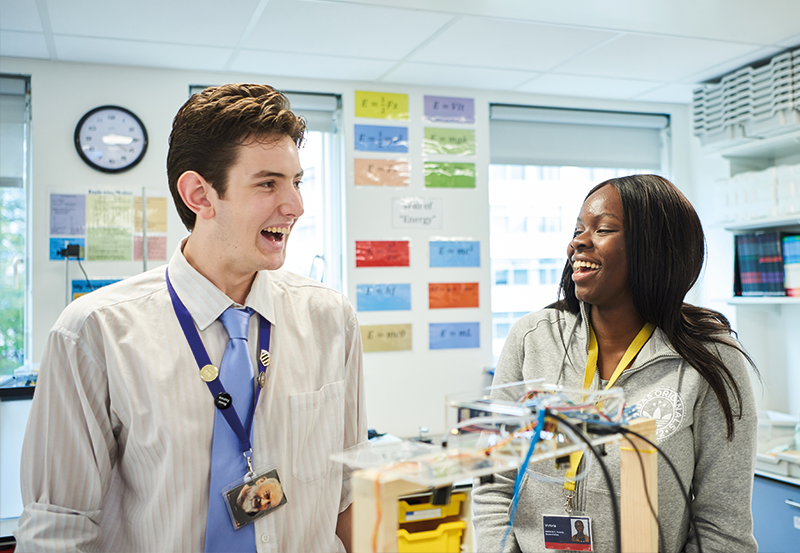 Male And Female Student Working In A Level Physics Class