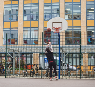 Student Playing Basketball At Abbey College Cambridge