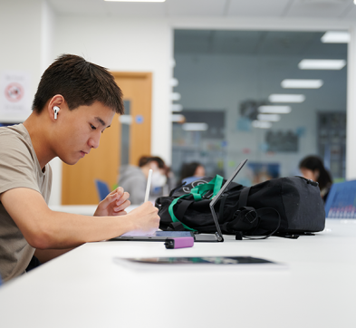 Student Revising In Abbey College Cambridge Library