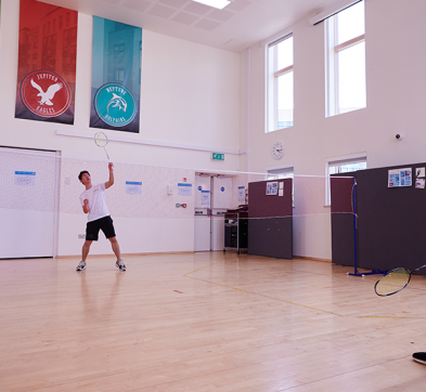 Students Playing Badminton In Abbey College Cambridge Hall