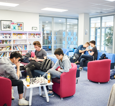 Students Relax In The Abbey College Cambridge Common Room