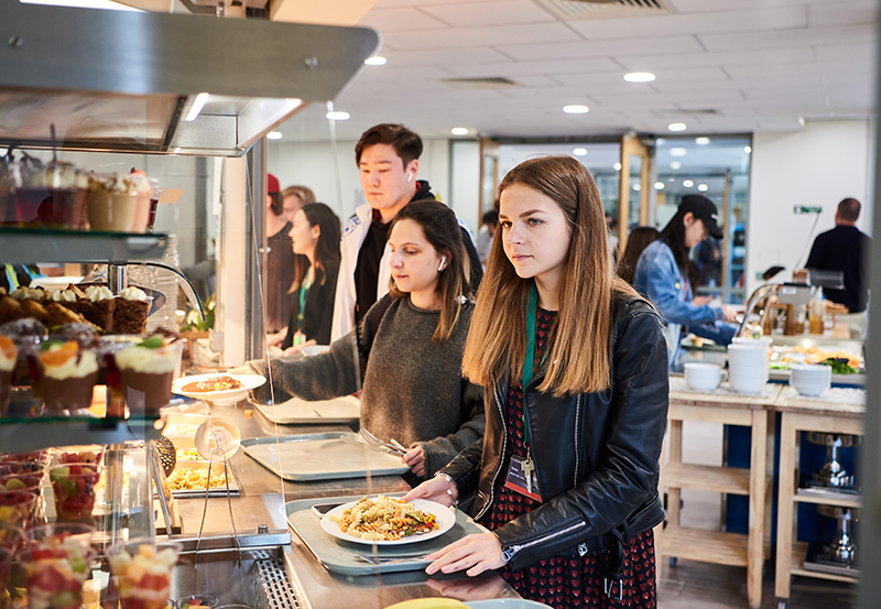 Abbey College Cambridge Female Student In Dining Room