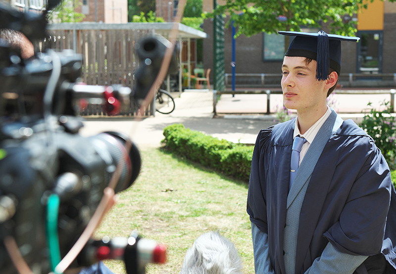 Abbey College Cambridge Student Being Interviewed At Graduation