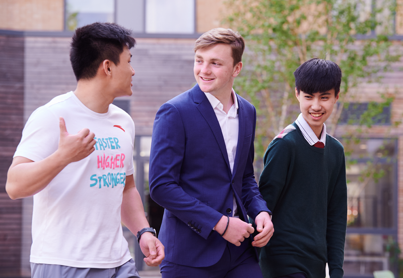 Students Walking In The Courtyard At Abbey College Cambridge