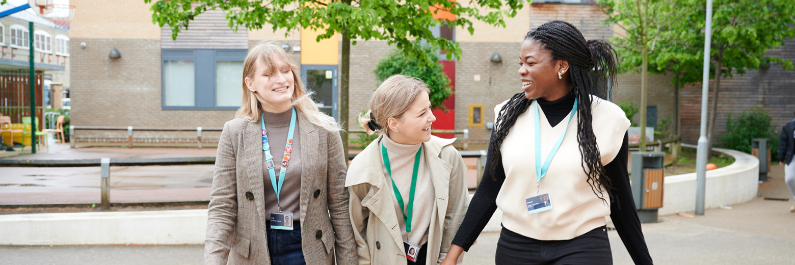 Female Students Walking In The Abbey College Cambridge Courtyard