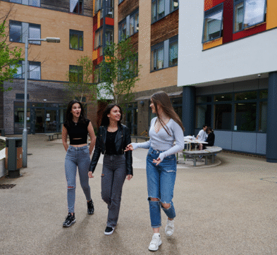 Students Walking In The Courtyard At Abbey College Cambridge
