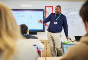 Teacher Standing At The Front Of Class